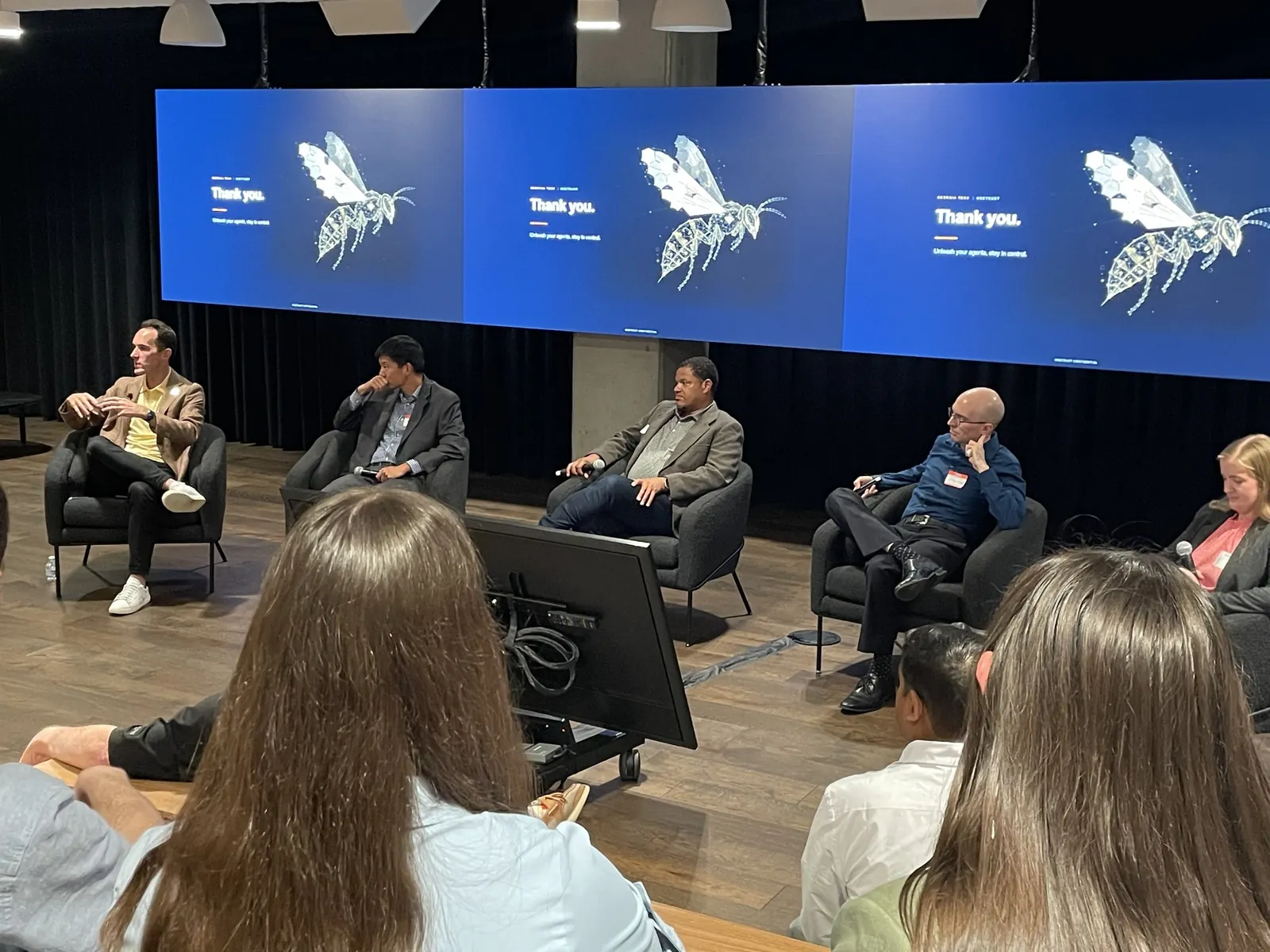 Speakers seated on stage during the OneTrust AI governance panel discussion